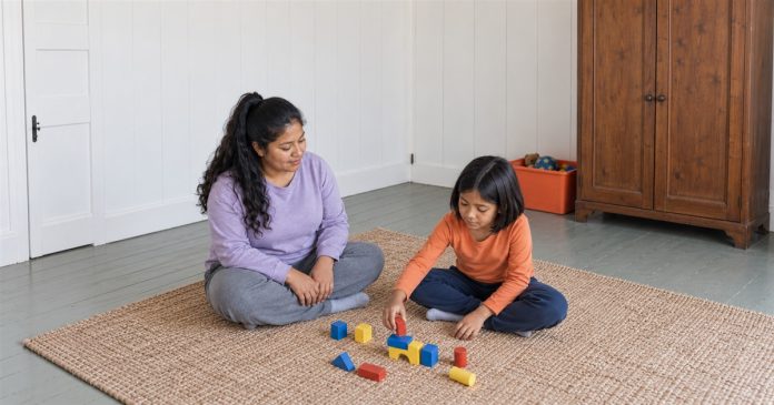 Child support — ordinary family play — realistic cover 2367 A woman in a lilac sweatshirt watching a child in an orange shirt play with colored wooden blocks on a woven rug in a white-paneled room.