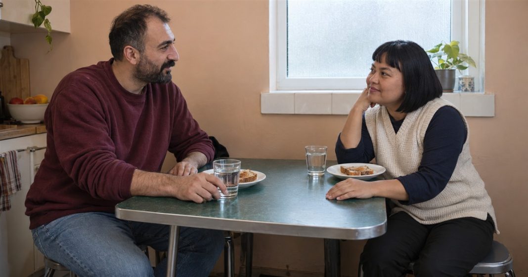 Your Chakra and Relationships — Ordinary Breakfast Conversation Two adults listening to each other over toast and water at a green kitchen table.