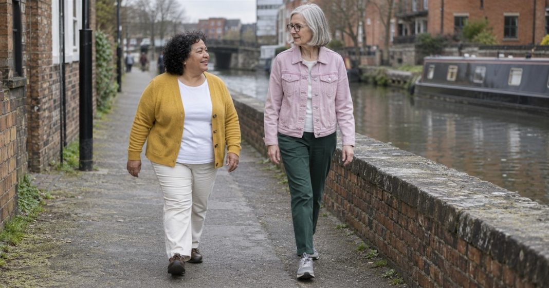 Relationships — shared canal walk realistic cover 3463 Two older women in mustard and pink jackets walking and talking beside a canal and a brick wall.
