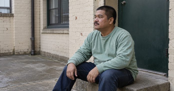 Clairaudience quiet courtyard attention realistic cover 3592 Man in a mint-green sweatshirt sitting quietly on a concrete doorstep in a brick courtyard