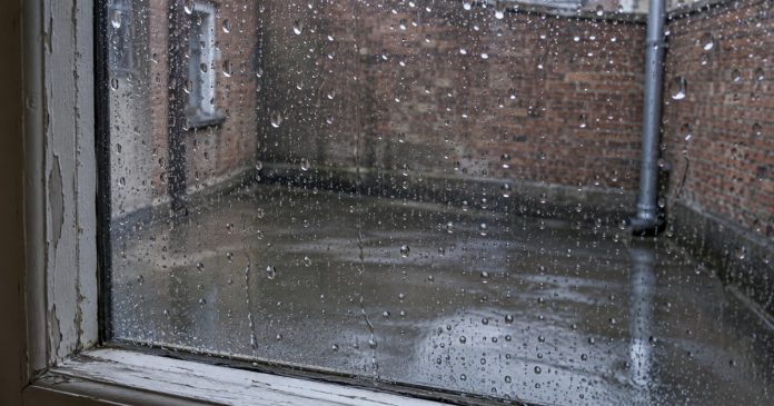 Psychic888 realistic rain window reflection 3856 Raindrops on a closed window overlooking a wet brick-walled courtyard.