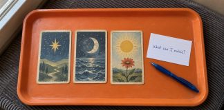 Three symbolic cards and a handwritten question, What can I notice?, on an orange tray